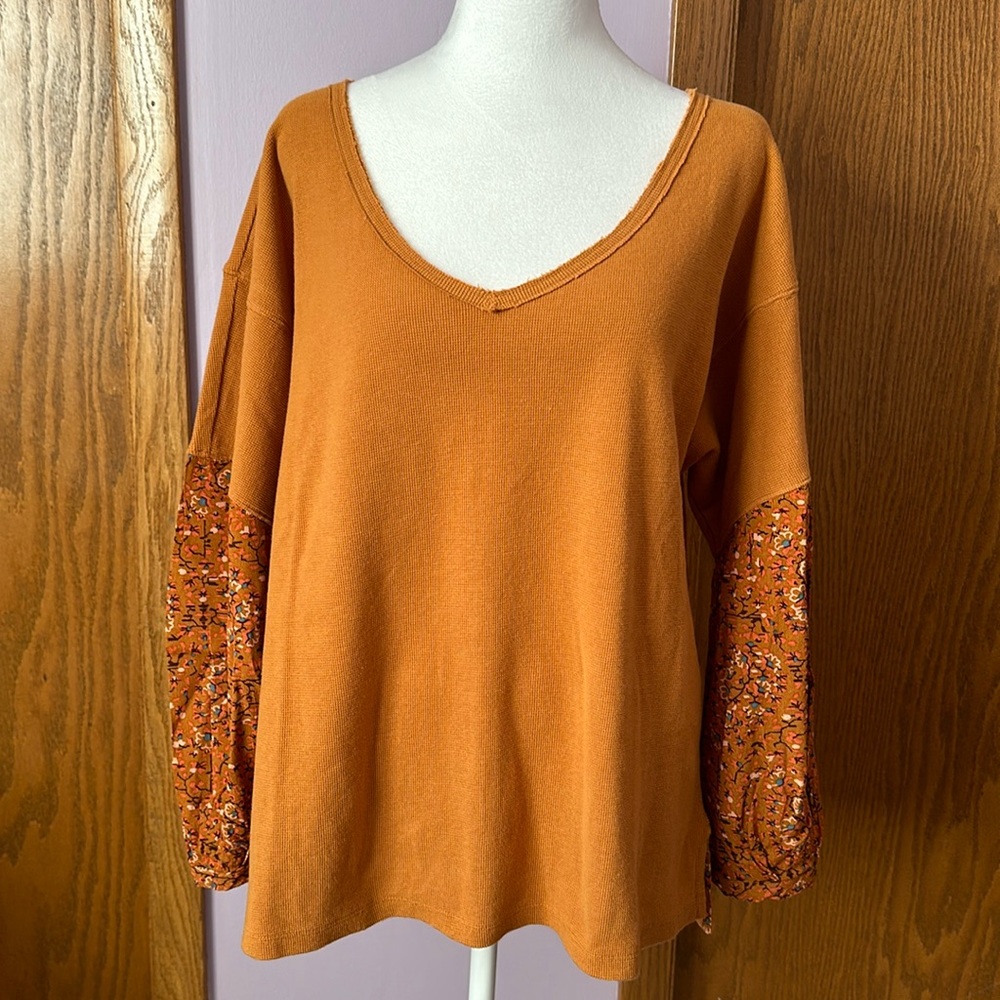 Anthropologie small top with long sleeves.